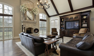 Family room with two story stone fireplace